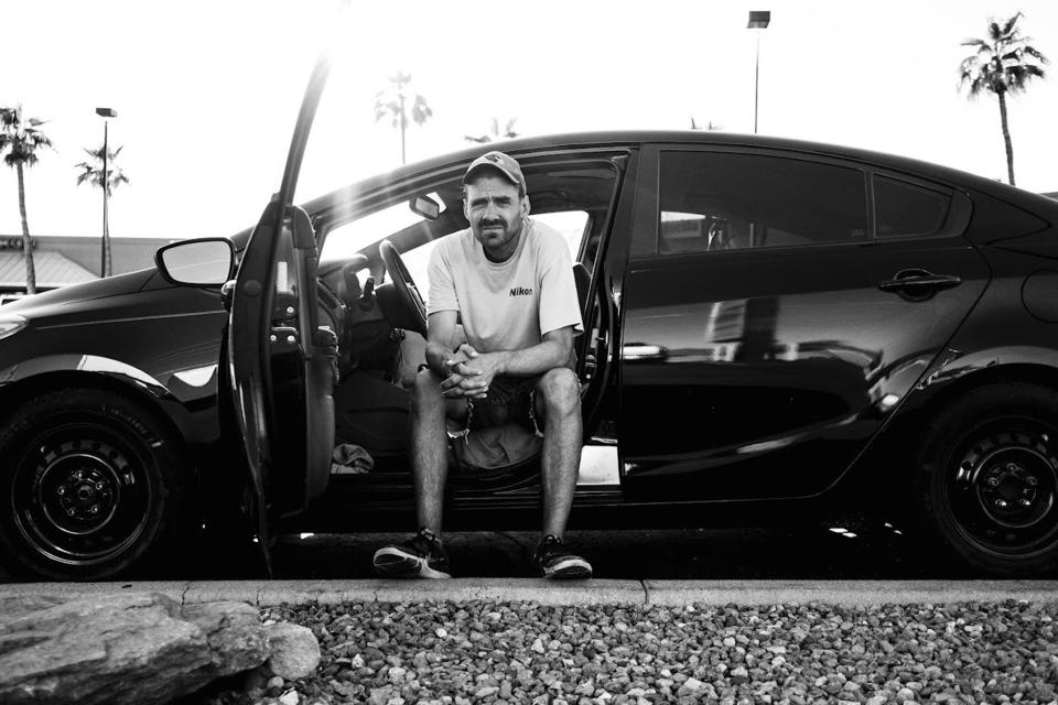 In this undated handout photo, a homeless man poses for a photograph by documentary photographer Eric Elmore in Phoenix. Elmore documented Phoenix's homeless people in addition to Roosevelt White III, who was 36 when he died of a stroke in September after falling ill in the Phoenix homeless encampment known as "The Zone". Roosevelt is among thousands of homeless people who died this year and are being remembered at winter solstice events for Homeless Persons' Memorial Day. (AP Photo/Matt York)