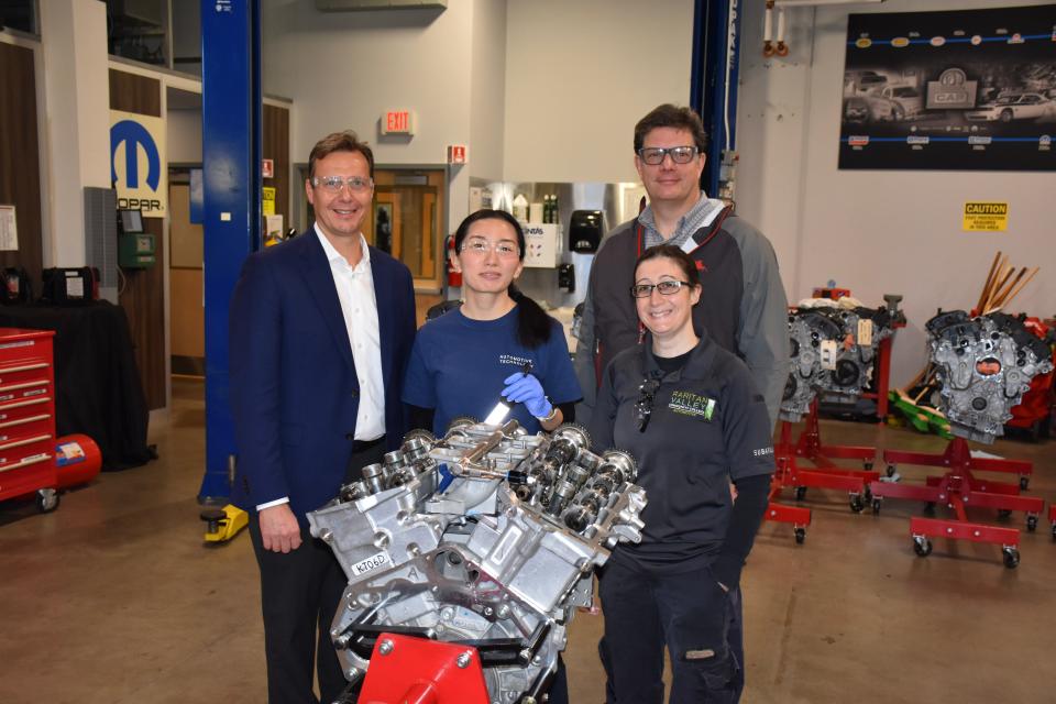 RVCC student Rui Zhu, second from left, examines one of the 17 gasoline test engines donated to the college’s  Automotive Technology program by ExxonMobil’s Technology Center in Clinton. With her, from left, are Andrew V. Sinclair, Northeast Public & Government Affairs, ExxonMobil Corporation; Sara Heller, instructor/coordinator, RVCC Automotive Technology; and Paul Rubas, ExxonMobil Advanced Engineering associate.