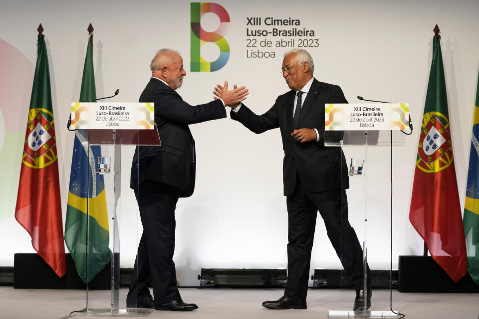 Brazilian President Luis Inacio Lula da Silva shakes hands with Portuguese Prime Minister Antonio Costa, right, after addressing journalists at the end of the Portugal-Brazil summit at the Belem Cultural Center in Lisbon, Saturday, April 22, 2023. Lula is in Lisbon for a four day state visit to Portugal. (AP Photo/Armando Franca)