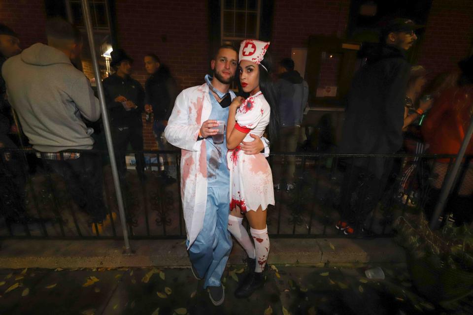 Patrons pose for a photo during the annual trolly square Halloween Loop Saturday, Oct. 27, 2018, at Kelly's Logan House in Wilmington.