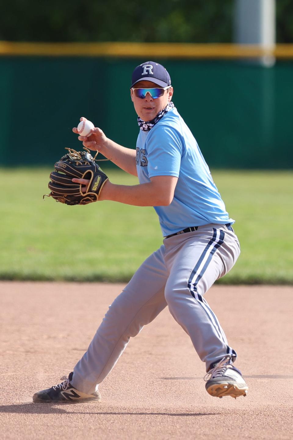 Rootstown second baseman Blake Bower looks to make a throw to first during Thursday night’s game against South Range.