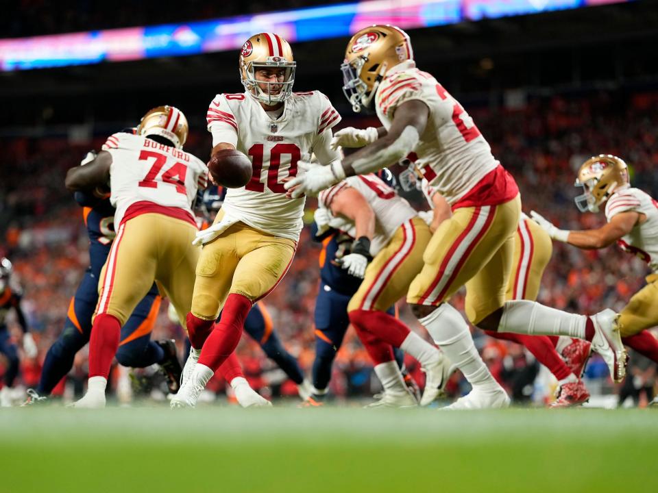 Jimmy Garoppolo fakes a handoff against the Denver Broncos.