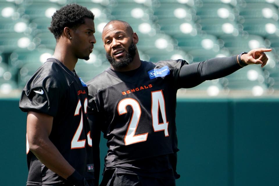 Cincinnati Bengals cornerback Dax Hill (23), left, talks with Cincinnati Bengals strong safety Vonn Bell (24), right, during organized team activities practice, Tuesday, June 14, 2022, at Paul Brown Stadium in Cincinnati.