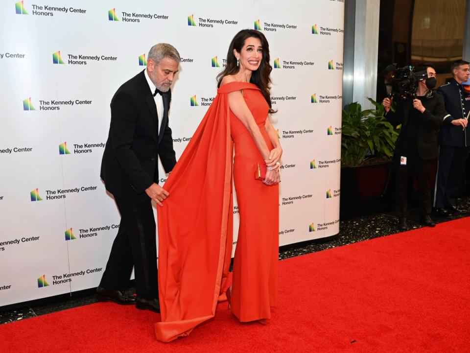 George Clooney fixes wife Amal’s dress at 2022 Kennedy Center Honors (AP)