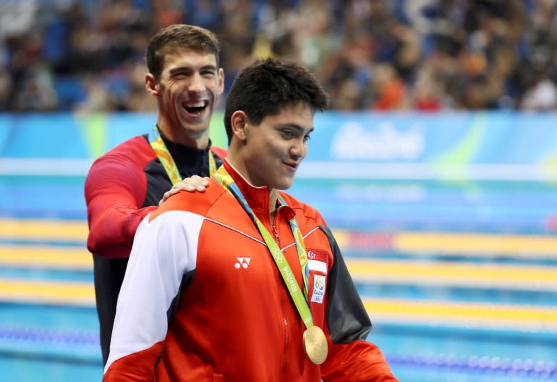 Michael Phelps congratulates Joseph Schooling. (Reuters)