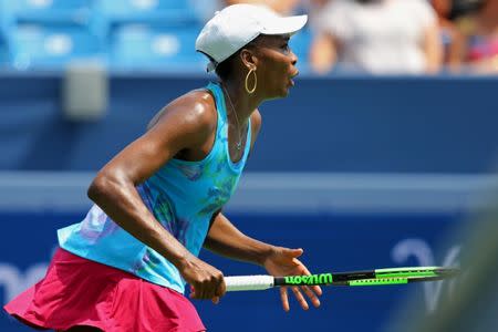 Aug 15, 2017; Mason, OH, USA; Venus Williams (USA) returns a shot against Alison Riske (USA) during the Western and Southern Open at Lindner Family Tennis Center. Mandatory Credit: Aaron Doster-USA TODAY Sports