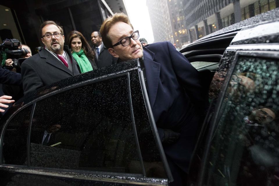 H. Ty Warner, the billionaire who created Beanie Babies, gets into a car outside the federal building in Chicago, Tuesday, Jan. 14, 2014, after being sentenced to two years of probation, but no prison time, for tax evasion on $25 million in income he had in Swiss bank accounts. (AP Photo/Andrew A. Nelles)