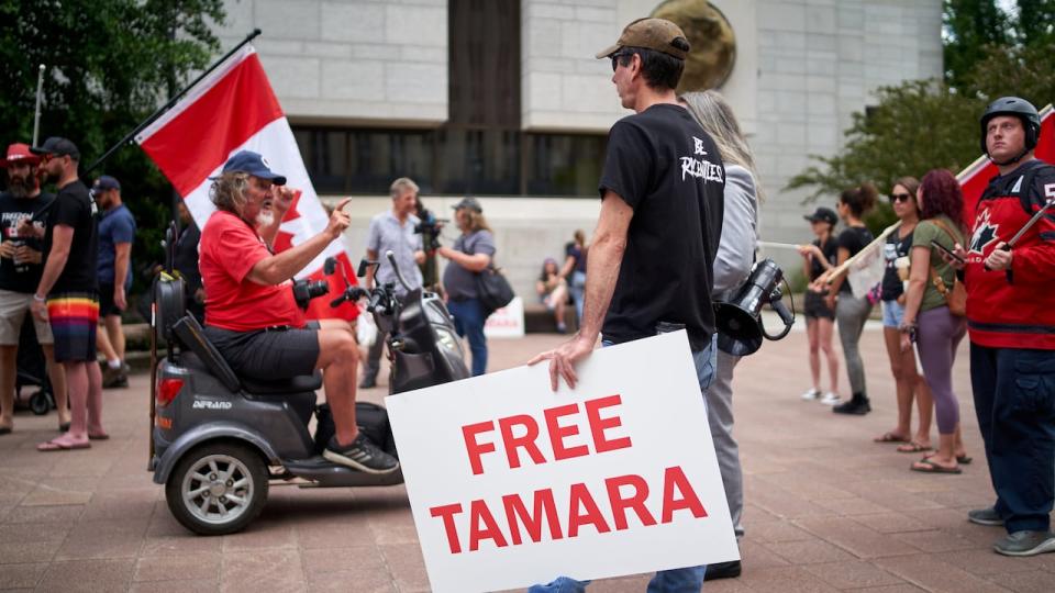 Tamara Lich supporters waved Canada flags and protested the fact she was in custody during a demonstration outside the Ottawa courthouse on July 8, 2022.