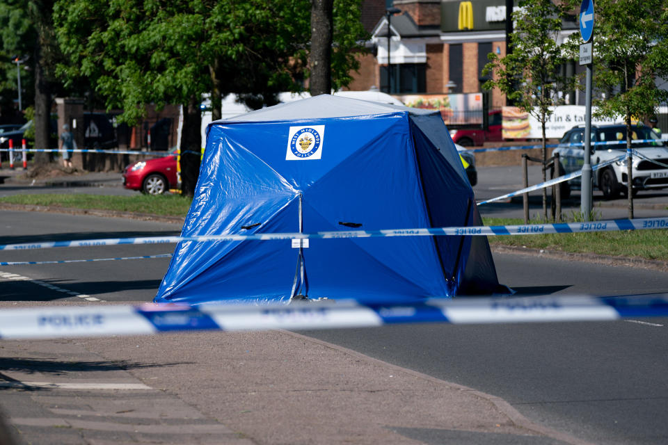 A police tent at the scene on College Road, Kingstanding, north of Birmingham, where a 14-year-old boy died after being stabbed on Monday evening. Police have launched a murder investigation and are hunting up to seven people in connection with the attack. Picture date: Tuesday June 1, 2021.