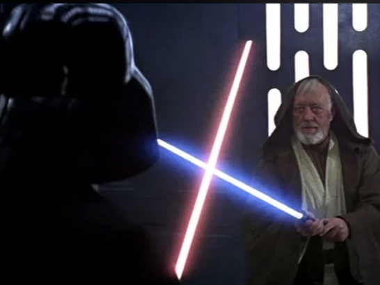 Two of the characters fighting with the lightsabers