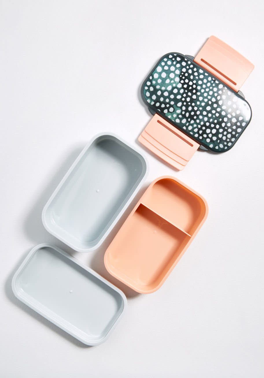Get her a super cute stackable one at <strong><a href="https://www.modcloth.com/shop/home-gifts/served-with-verve-bento-box-in-multi/100000313248.html?kpid=10108192-MULTI-NS&amp;gclid=CjwKCAiAjNjgBRAgEiwAGLlf2i9lhdEDCdgmx0jHpq_V1k5pTOjAAQ3VBADf_0SizcOpDaRbG4pMOBoCoX4QAvD_BwE&amp;gclsrc=aw.ds">Modcloth</a></strong> &mdash; and don&rsquo;t forget <strong><a href="https://www.amazon.com/Bees-Wrap-Assorted-Sustainable-Honeycomb/dp/B0126LMDFK">the reusable beeswax sandwich wraps</a></strong>!