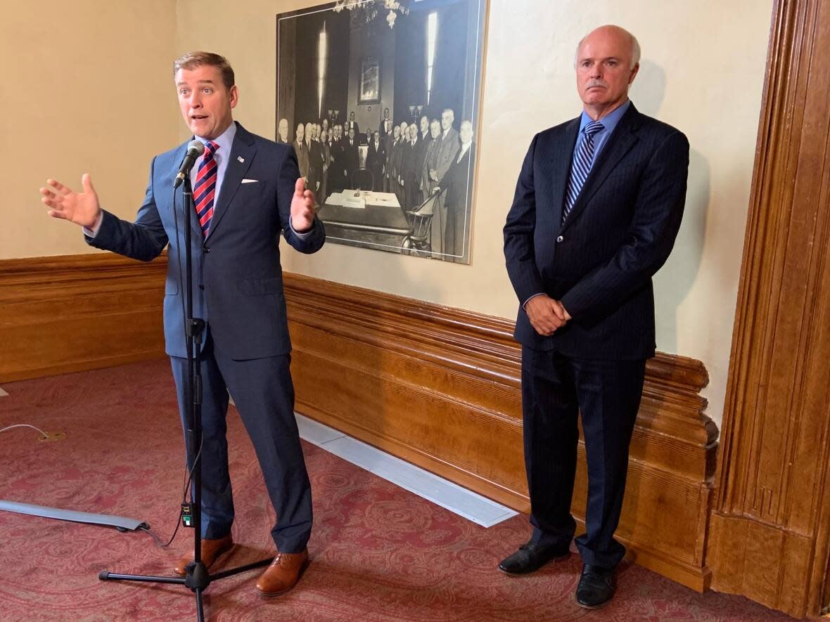 Newfoundland and Labrador Premier Andrew Furey, left, says new legislation will give the province a competitive edge for attracting doctors. Health Minister Tom Osborne says more details will come next week. (Darrell Roberts/CBC - image credit)