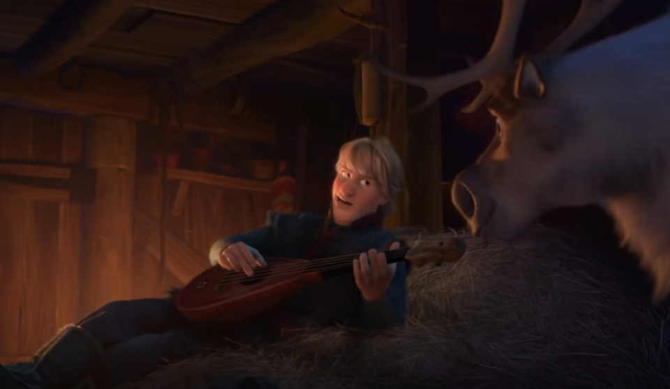 kristoff singing and playing on a haystack