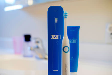 A Beam toothbrush and toothpaste stand on a vanity at Scott Ozawa's home in Belmont, California, U.S. December 18, 2016. Picture taken December 18, 2016. REUTERS/Noah Berger