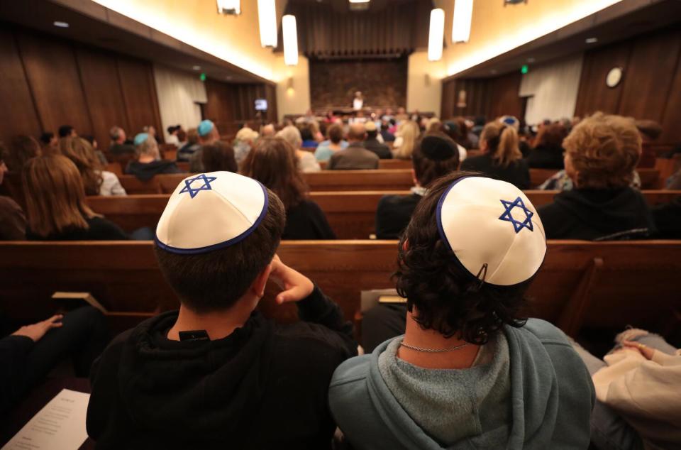 Temple Ner Simcha on Thursday, Nov. 9, 2023 in Westlake Village, CA. Alon Ohan, 12, left, and