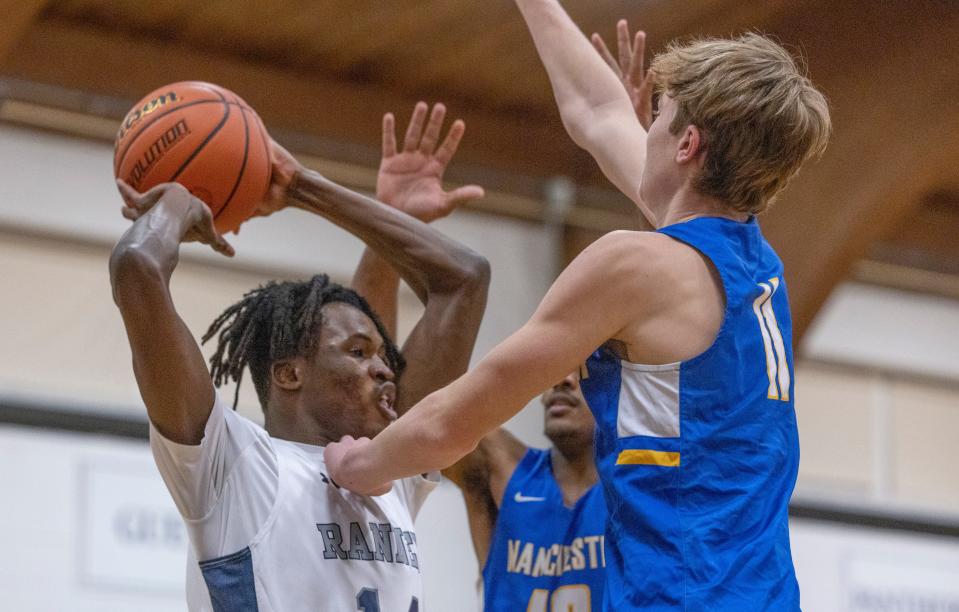 Ranney Charles Anyichie looks to pass in during first half action. Ranney Boys Basketball defeats Manchester in Tinton Falls on January 26, 2022. 