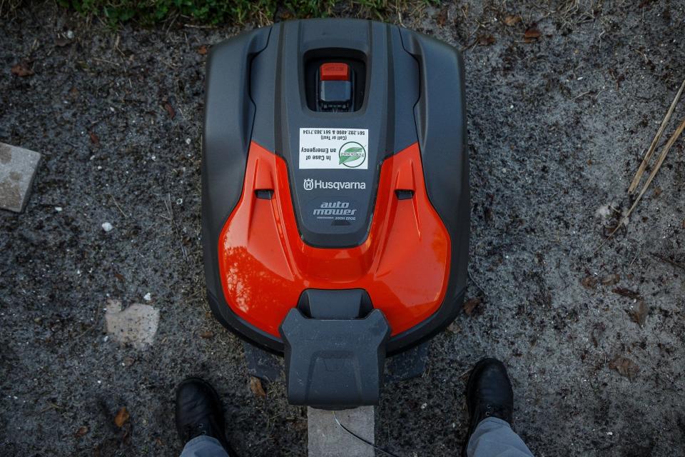 Husqvarna Auto Mowers are seen at Bear Island, a gated community in West Palm Beach, Fla., on August 10, 2023. The mowers are now going to be purchased by the town of Exeter in New Hampshire for use on athletic fields.