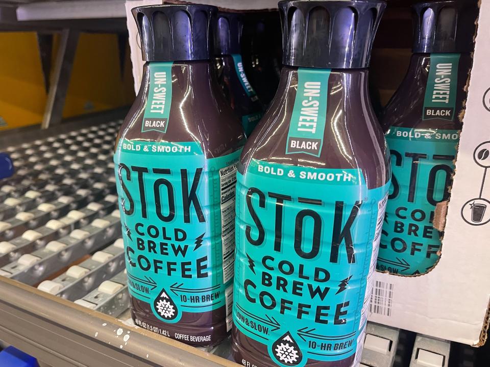 Two glass bottles of Stok Cold-Brew coffee with blue labels