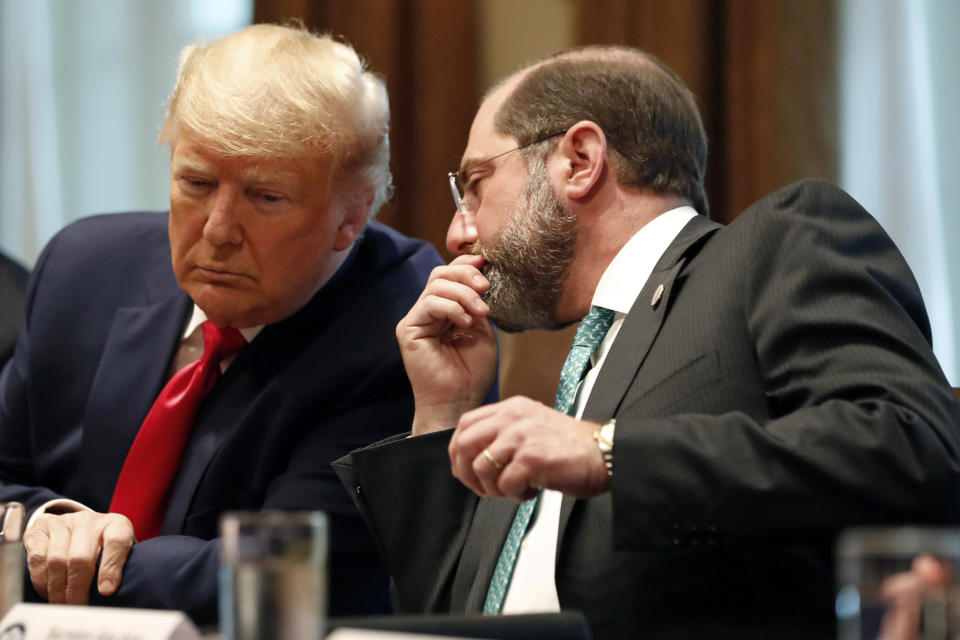 President Donald Trump listens to Health and Human Services Secretary Alex Azar in the Cabinet Room of the White House on March 2, 2020. (Andrew Harnik / AP file)