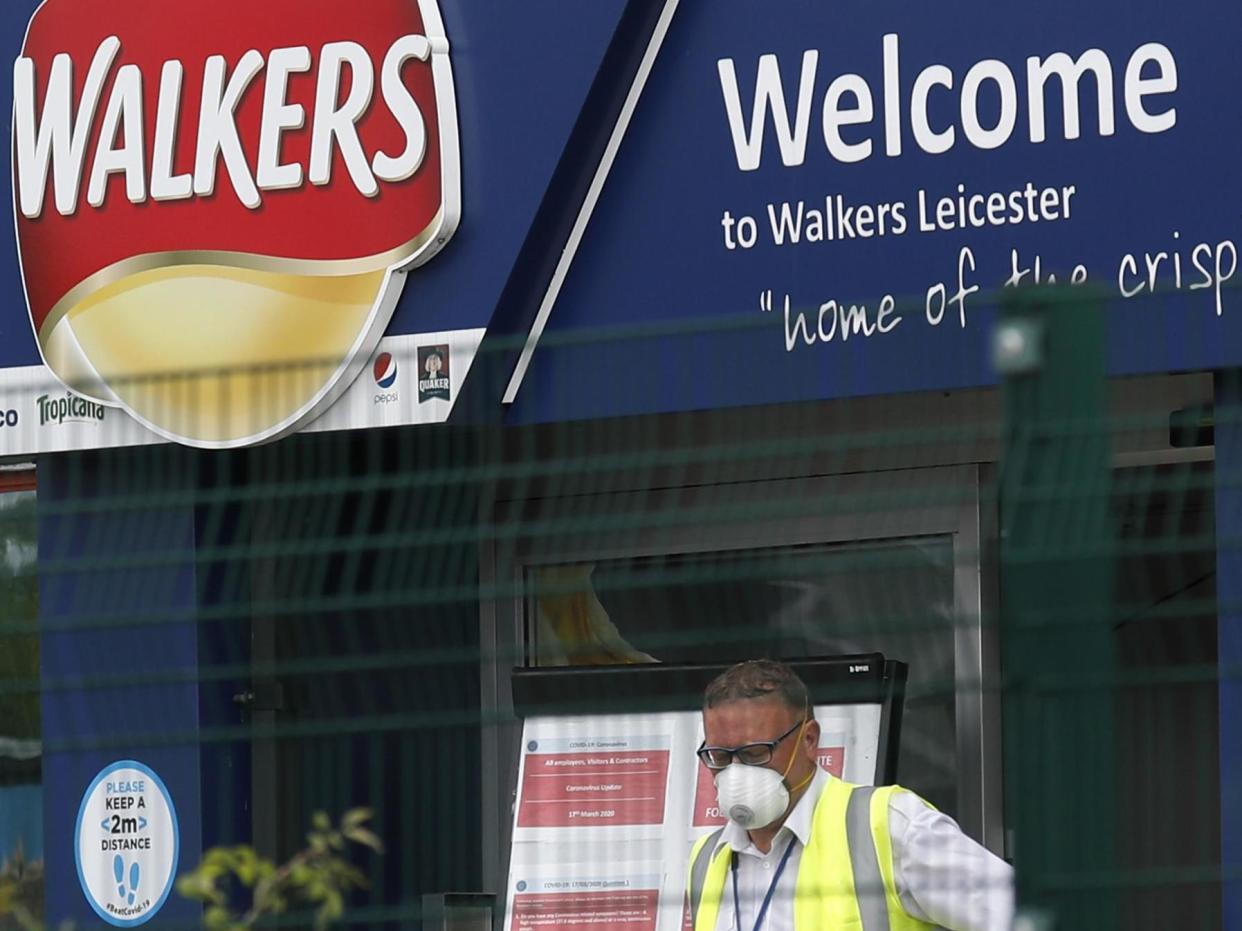 A man exits the Walkers Crisps factory that has confirmed cases of coronavirus amongst its workers in Leicester: Darren StaplesGetty Images