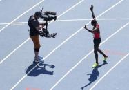 Conseslus Kipruto of Kenya gestures after winning the gold. REUTERS/Fabrizio Bensch