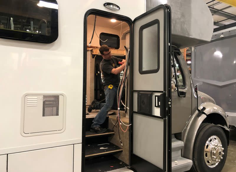 FILE PHOTO: An assembly line worker works on the production line at Renegade RV manufacturing plant in Bristol, Indiana