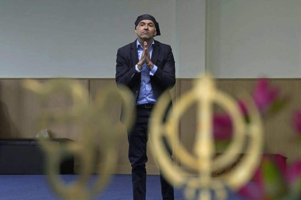 Gurch Randhawa prays in the newly built Guru Nanak Gurdwara, in Luton, England, Thursday, April 27, 2023. King Charles III visited the Sikh house of worship last year as part of his efforts to build bridges with faith groups and show that the monarchy, a 1,000-year-old institution with Christian roots, can still represent the people of modern, multi-cultural Britain. (AP Photo/Kin Cheung)