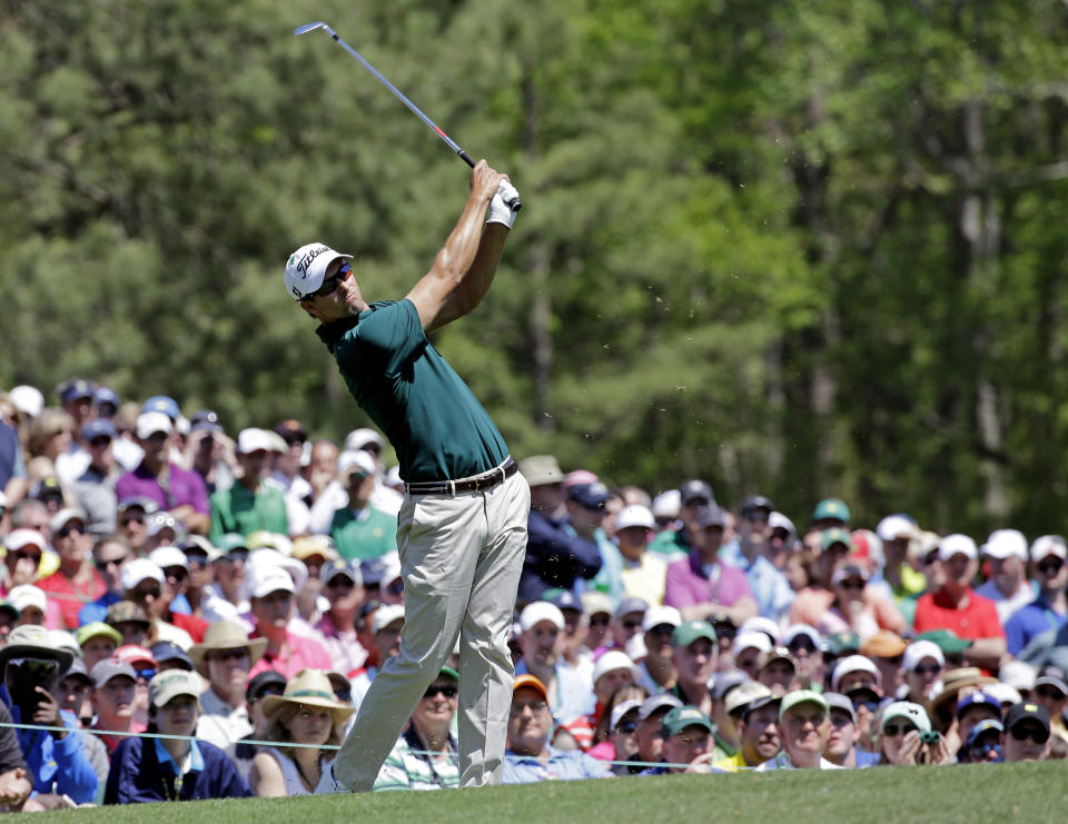 Adam Scott, of Australia, tees off on the 12th hole during the first round of the Masters golf tournament Thursday, April 10, 2014, in Augusta, Ga. (AP Photo/David J. Phillip)