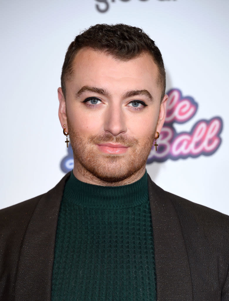 A closeup of Sam Smith smiling