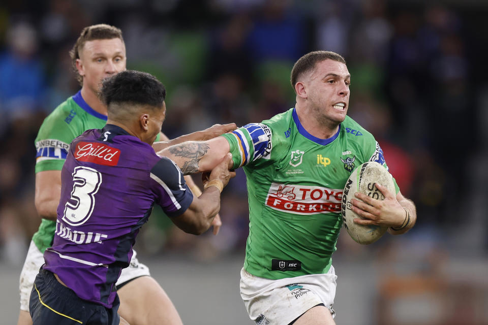 Seen here, Adam Elliott taking the ball up for the Canberra Raiders during an NRL game against the Melbourne Storm in 2022. 