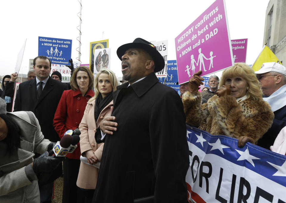 FILE - In a Tuesday, Feb. 4, 2014 file photo, former Republican candidate for lieutenant governor, E.W. Jackson, center, speaks to the media during a demonstration outside Federal Court in Norfolk, Va. Jackson spoke in favor of the law banning same sex marriage. In Virginia, Utah, Oklahoma and Kentucky, federal judges have struck down part or all of the bans on same-sex marriage that voters approved between 2004 and 2006. Each of the rulings has been stayed, pending appeals, but the trend is unsettling to the activists who oppose gay marriage. (AP Photo/Steve Helber, File)