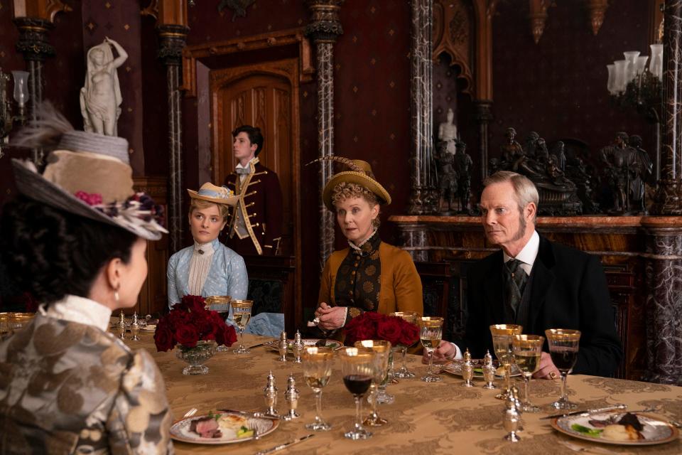 Louisa Jacobson, Cynthia Nixon, and Bill Irwin in a scene from "The Gilded Age" shot in the Lyndhurst dining room.
