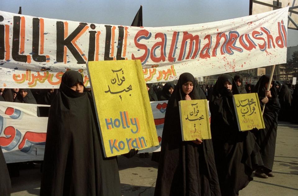<div class="inline-image__caption"><p>Demonstrators in Tehran call for the death of Indian-British writer Salman Rushdie after a fatwa was issued by Ayatollah Ruhollah Khomeini condemning him to death for blasphemy after the publication of his novel <em>The Satanic Verses</em>, February 1989. </p></div> <div class="inline-image__credit">Kaveh Kazemi/Getty Images</div>
