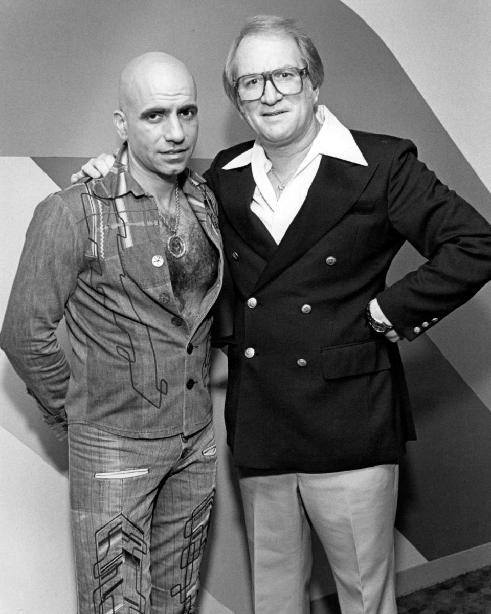 Entertainer Joe Savage, left, takes a picture with Red’s owner Arnie “Red” Shapiro around 1980 in Akron.