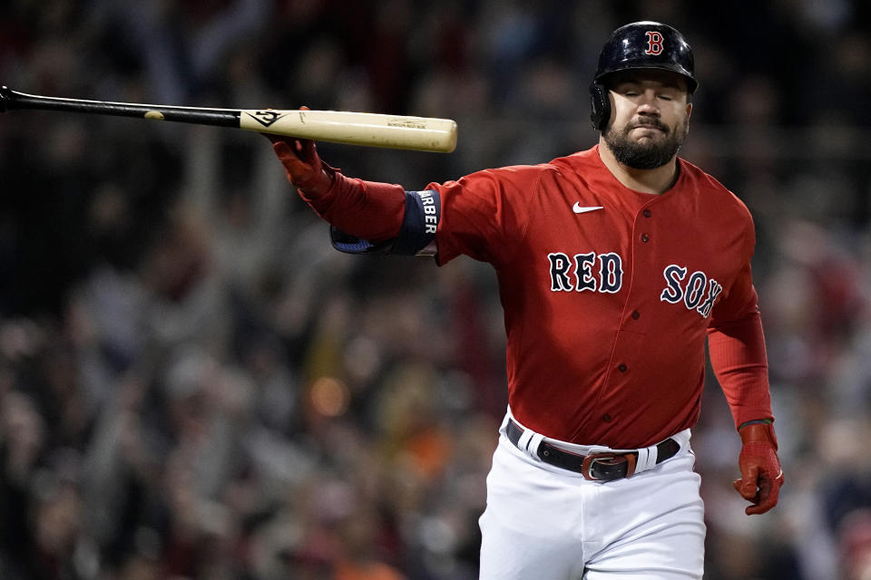 Boston Red Sox's Kyle Schwarber tosses his bat after a grand slam home run against the Houston Astros during the second inning in Game 3 of baseball's American League Championship Series Monday, Oct. 18, 2021, in Boston. (AP Photo/David J. Phillip)