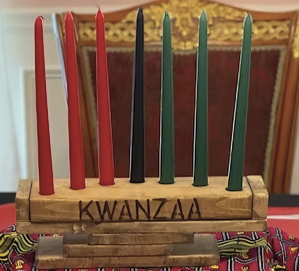 This image provided by Erica Jones shows a kinara that she made holding seven candles in the colors of Kwanzaa. (Erica Jones via AP).