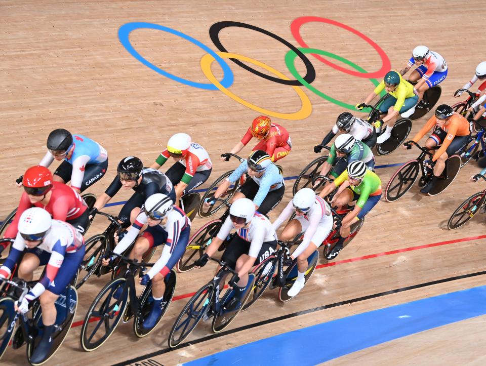 <p>Cyclists compete in the women's track cycling omnium scratch race during the Tokyo 2020 Olympic Games at Izu Velodrome in Izu, Japan, on August 8, 2021. (Photo by Peter PARKS / AFP)</p> 