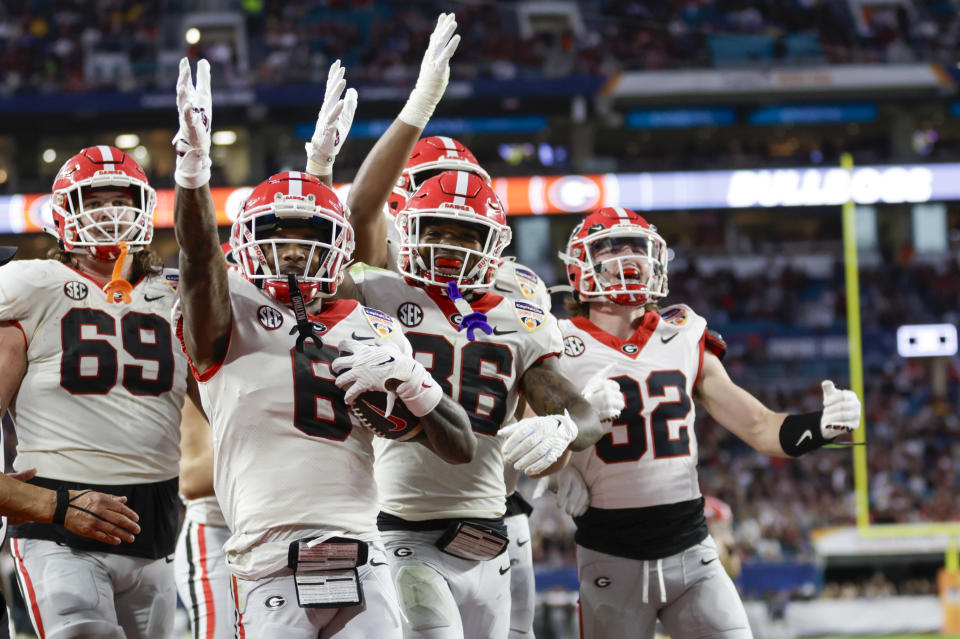 MIAMI GARDENS, FL - DECEMBER 30: Georgia Bulldogs wide receiver Dominic Lovett (6) celebrates a touchdown with teammates during the game between the Georgia Bulldogs and the Florida State Seminoles on December 30, 2023 at Hard Rock Stadium in Miami Gardens, Fl.  (Photo by David Rosenblum/Icon Sportswire via Getty Images)