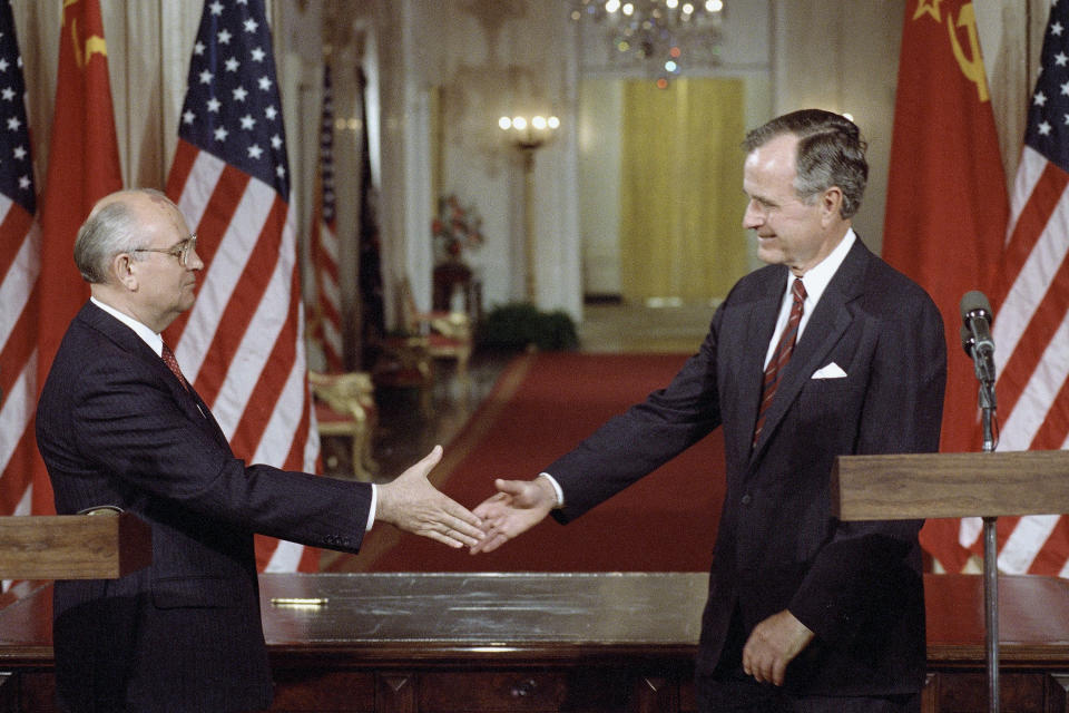 FILE - Soviet President Mikhail Gorbachev, left, and President George H. Bush shake hands following the signing of accords at the White House in Washington, Friday, June 1, 1990. Russian news agencies are reporting that former Soviet President Mikhail Gorbachev has died at 91. The Tass, RIA Novosti and Interfax news agencies cited the Central Clinical Hospital. (AP Photo/Ron Edmonds, file)