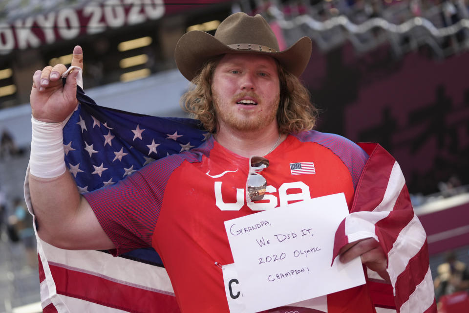 Ryan Crouser, of United States, celebrates after winning the final of the men's shot put at the 2020 Summer Olympics, Thursday, Aug. 5, 2021, in Tokyo. (AP Photo/Matthias Schrader)