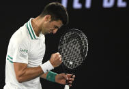 Serbia's Novak Djokovic reacts after winning a point against Russia's Daniil Medvedev during the men's singles final at the Australian Open tennis championship in Melbourne, Australia, Sunday, Feb. 21, 2021.(AP Photo/Andy Brownbill)