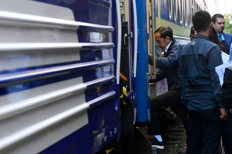 In this photo released by Press and Media Bureau of the Indonesian Presidential Palace, President Joko Widodo, left, boards a train that will take him to Kyiv, Ukraine, at a railway station in Przemysl, Poland on Tuesday, June 28, 2022. (Indonesian Presidential Palace via AP)