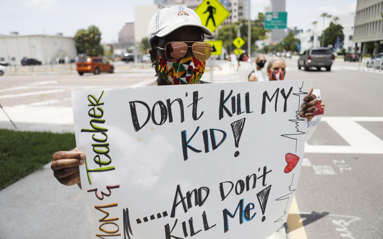 Teachers in Florida protest the reopening of schools amid an outbreak in the state - Octavio Jones /Getty