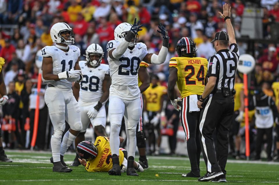 Nov 4, 2023; College Park, Maryland, USA; Penn State Nittany Lions defensive end Adisa Isaac (20) reacts after sacking Maryland Terrapins quarterback Taulia Tagovailoa (3) during the second half at SECU Stadium. Mandatory Credit: Tommy Gilligan-USA TODAY Sports