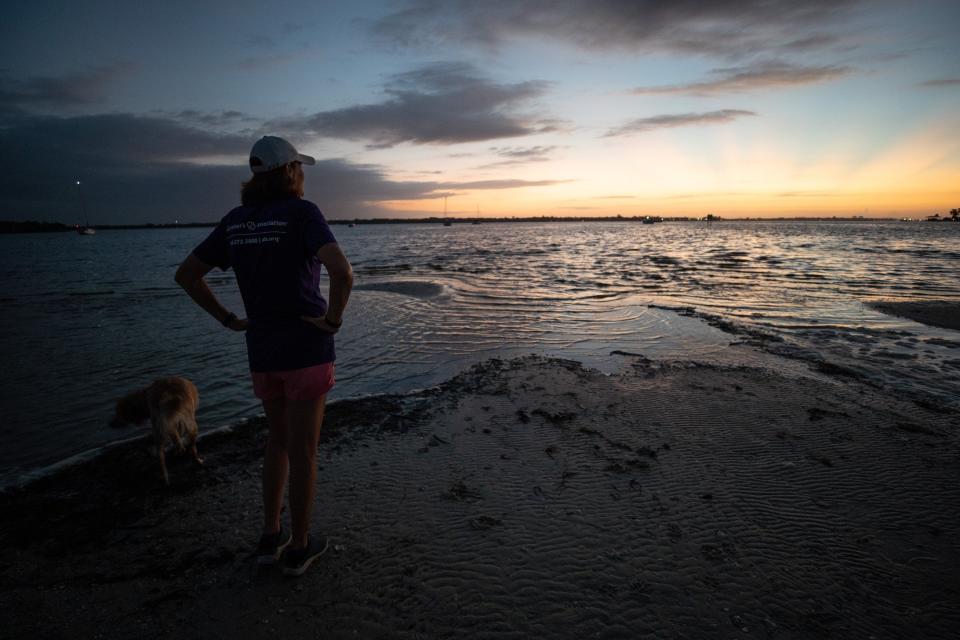 Michele Hall, 55, of Bradenton, Fla., watches the sunrise during her morning walk at the De Soto National Memorial on Sunday, Sept. 25, 2022, in Bradenton. Hall was diagnosed with Alzheimer’s disease when she was 53. “I can’t read or write or any of that stuff. But I can talk.” | Angelica Edwards, Tampa Bay Times