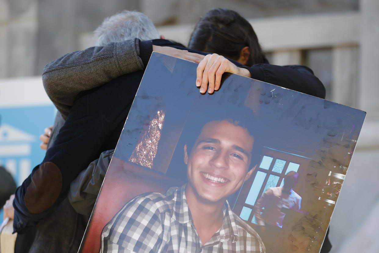 Family members of Manuel Esteban Paez Terán embrace during a press conference, Monday, March 13, 2023, in Decatur, Ga. A press conference was held to give additional autopsy findings in Terán's death. (AP Photo/Alex Slitz)