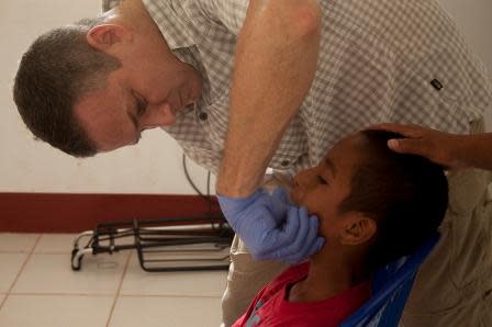 Dr. Robert Fuller treating a child