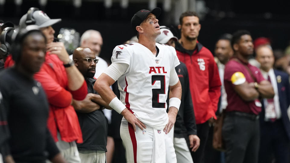 Atlanta Falcons quarterback Matt Ryan (2) watches a replay on the sidelines during the second half of an NFL football game against the Philadelphia Eagles, Sunday, Sept. 12, 2021, in Atlanta. The Philadelphia Eagles won 32-6. (AP Photo/John Bazemore)