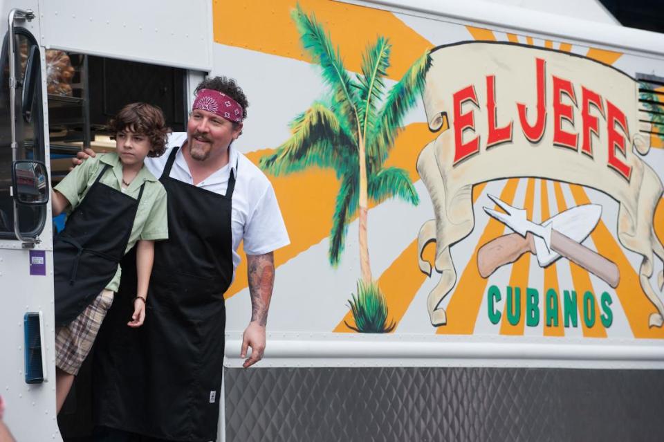 This image released by Open Road Films shows Emjay Anthony, left, and John Favreau in a scene from "Chef." (AP Photo/Open Road Films, Merrick Morton)