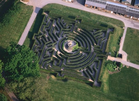 The maze at Leeds Castle comprises 2,400 yew trees - Credit: GETTY